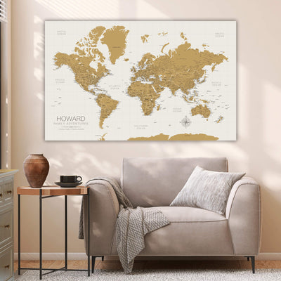 a living room with a couch and a map on the wall