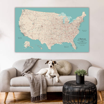 a dog sitting on a couch in front of a map of the united states