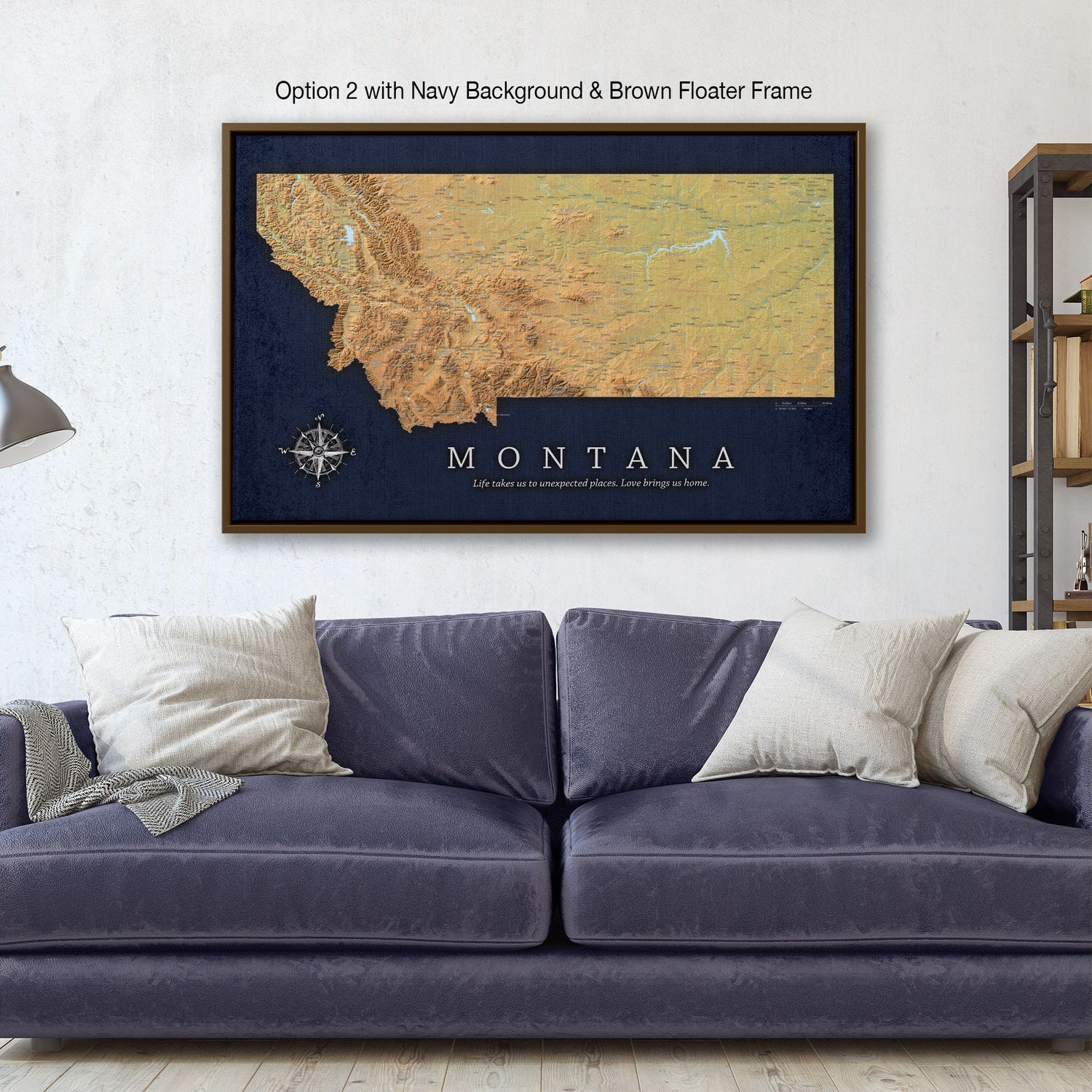 a living room with a blue couch and a framed map of the state of montana