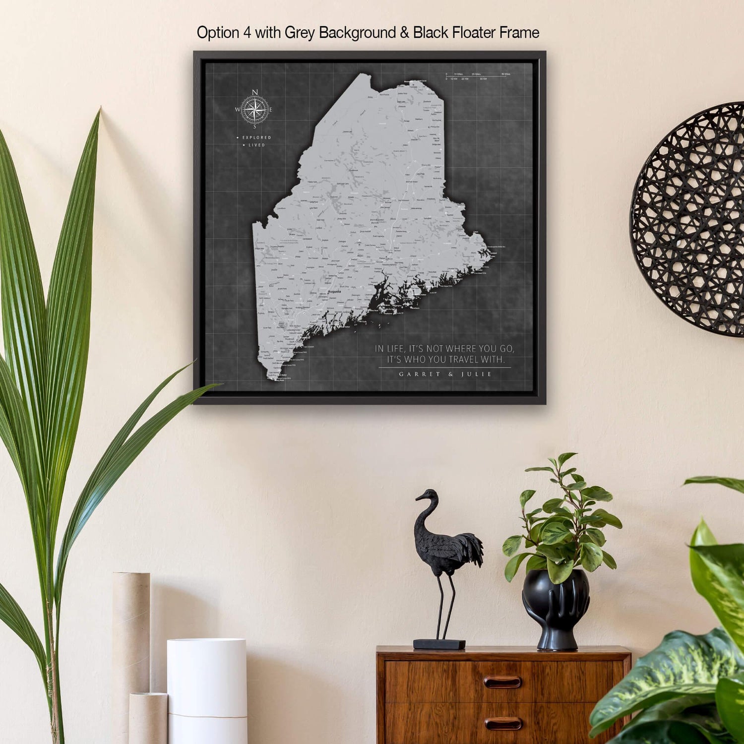 a framed map of the state of maine on a wall