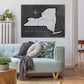 a couch in a living room with a map of new york on the wall