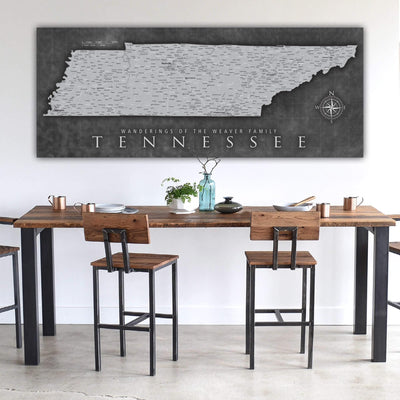 a dining room table with chairs and a map on the wall