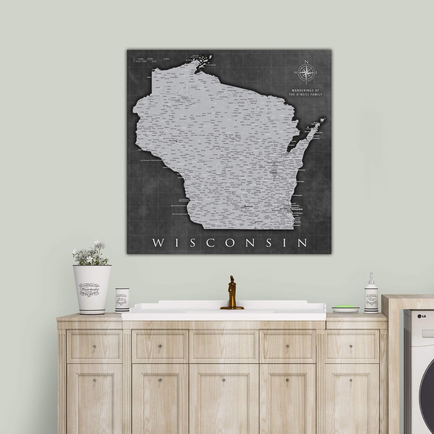 a black and white map of wisconsin on a wall above a washer and dry