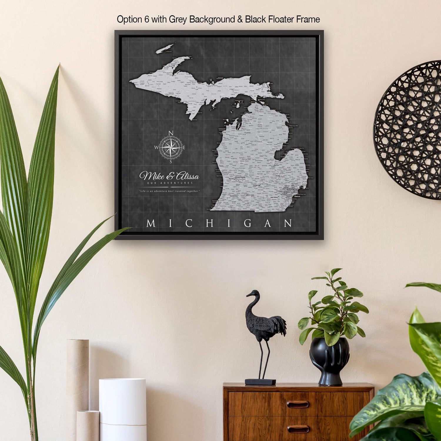 a framed map of michigan hangs on a wall