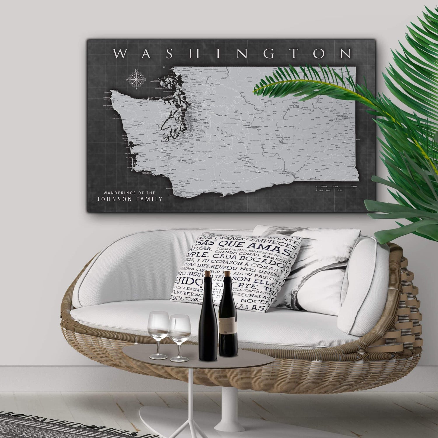 a living room with a wicker chair and a map on the wall